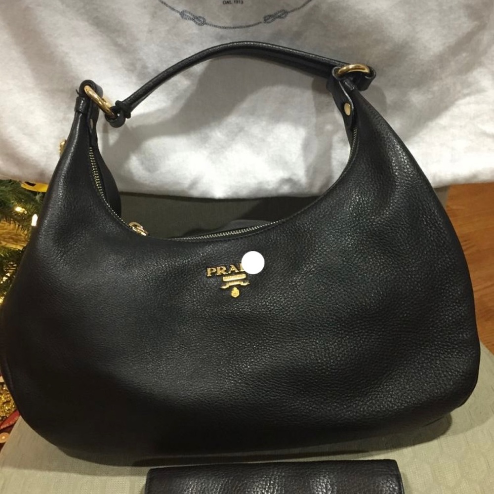 Pre-owned PRADA Hobo bag in black soft leather. With gold hardware